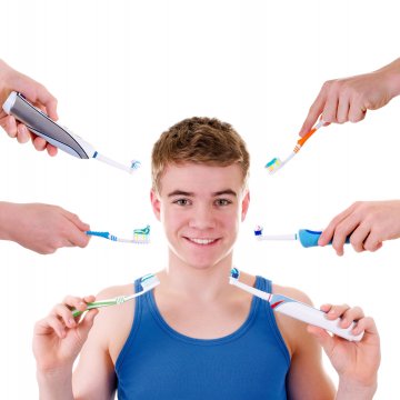 guy with lots of toothbrush options